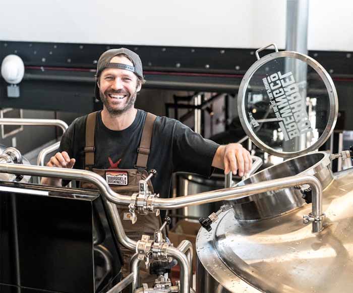 Man Standing Near Machine Small Business